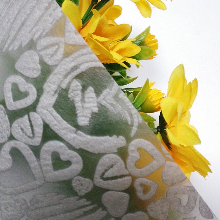 Non-woven tissue wrapping paper