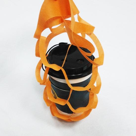 Folded non-woven coffee cup holder